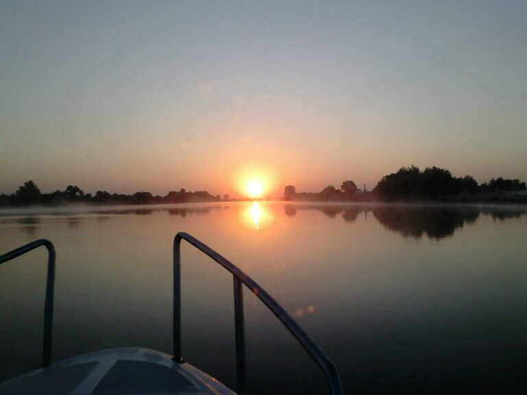 Sunrise on a peaceful lake.